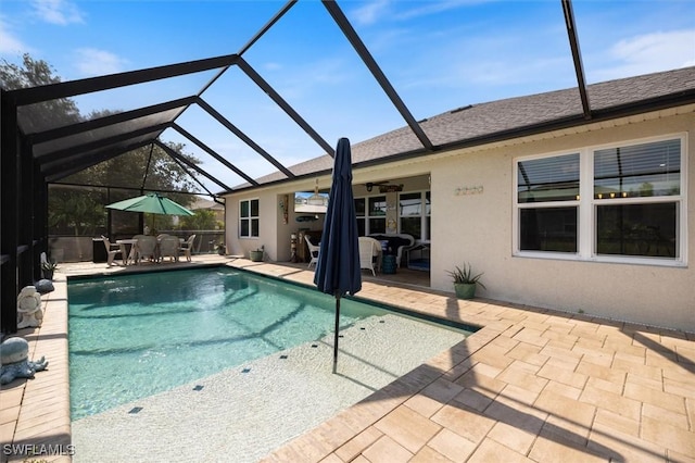1713 NW 9th Ter, Cape Coral, FL 33993 - swimming pool with a patio, outdoor dining space, ceiling fan, and glass enclosure