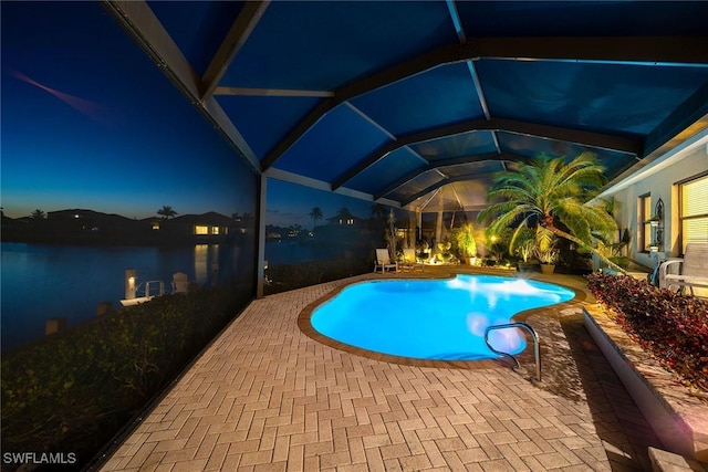 170 June Ct, Marco Island, FL 34145 - pool at twilight with a patio area, a lanai, an outdoor pool, and a water view