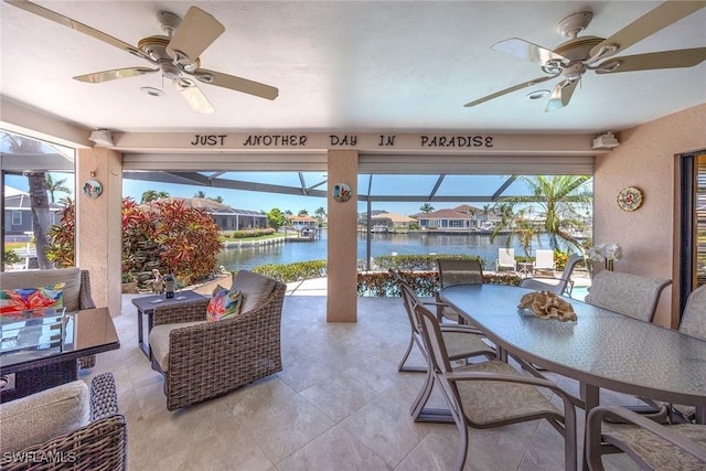 170 June Ct, Marco Island, FL 34145 - view of patio / terrace with ceiling fan, a water view, outdoor dining area, and a lanai