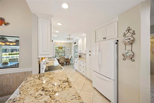 170 June Ct, Marco Island, FL 34145 - kitchen featuring freestanding refrigerator, white cabinetry, a ceiling fan, and recessed lighting