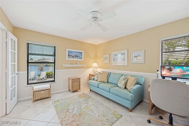 170 June Ct, Marco Island, FL 34145 - living area with tile patterned flooring, plenty of natural light, ceiling fan, and baseboards