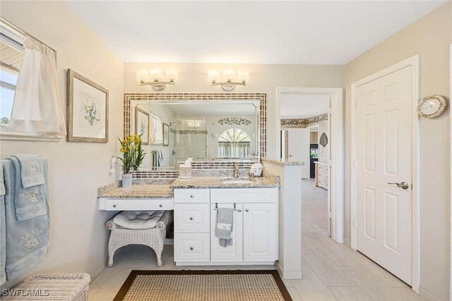 170 June Ct, Marco Island, FL 34145 - full bath featuring plenty of natural light, a stall shower, vanity, and tile patterned flooring