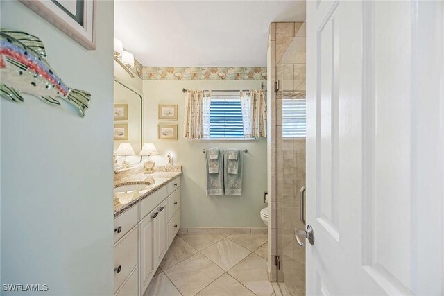 170 June Ct, Marco Island, FL 34145 - full bathroom featuring vanity, a shower stall, toilet, and tile patterned floors