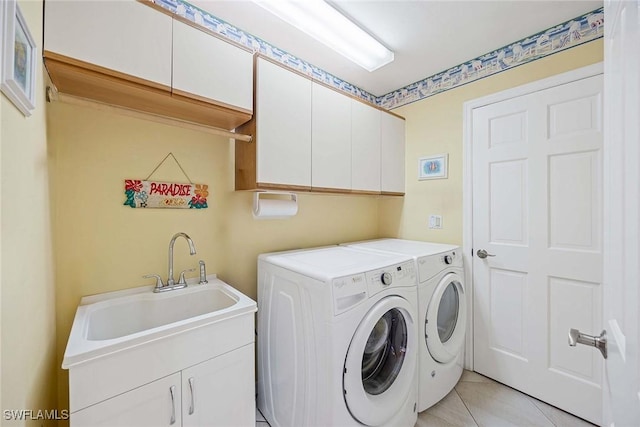 170 June Ct, Marco Island, FL 34145 - laundry area featuring cabinet space, separate washer and dryer, and light tile patterned floors