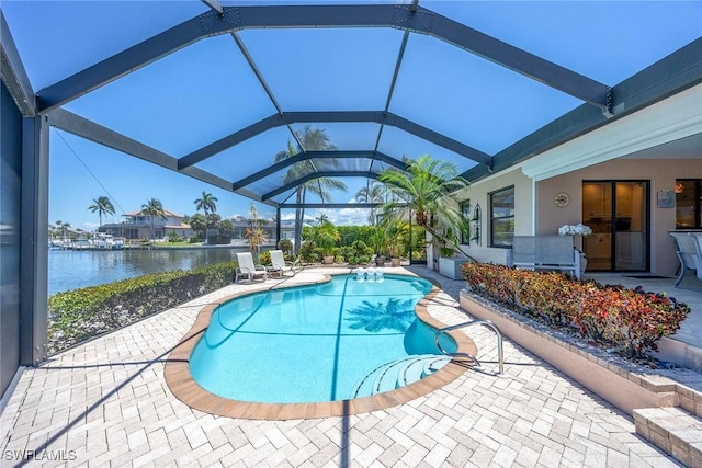 170 June Ct, Marco Island, FL 34145 - outdoor pool featuring a patio area, a water view, and glass enclosure