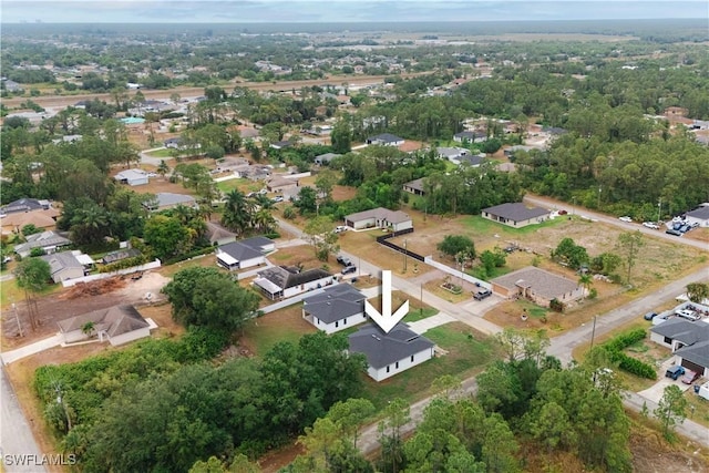 3201 18th St W, Lehigh Acres, FL 33971 - aerial view of property and surrounding area featuring nearby suburban area