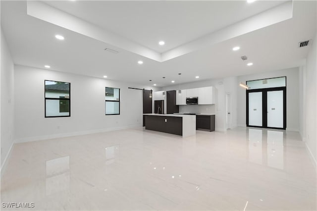 3201 18th St W, Lehigh Acres, FL 33971 - unfurnished living room featuring recessed lighting, baseboards, a sink, and a barn door