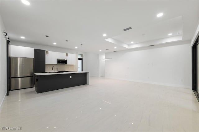 3201 18th St W, Lehigh Acres, FL 33971 - kitchen with appliances with stainless steel finishes, recessed lighting, white cabinetry, a kitchen island with sink, and modern cabinets