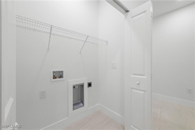 3201 18th St W, Lehigh Acres, FL 33971 - laundry area featuring hookup for a washing machine, electric dryer hookup, and baseboards