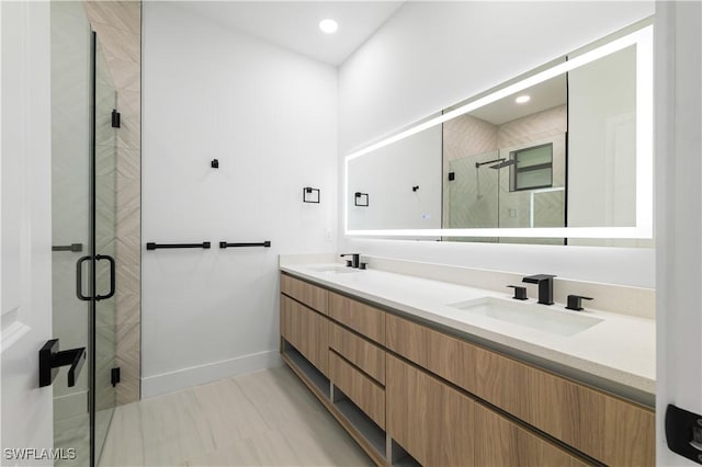 3201 18th St W, Lehigh Acres, FL 33971 - bathroom with a shower stall, double vanity, baseboards, and recessed lighting