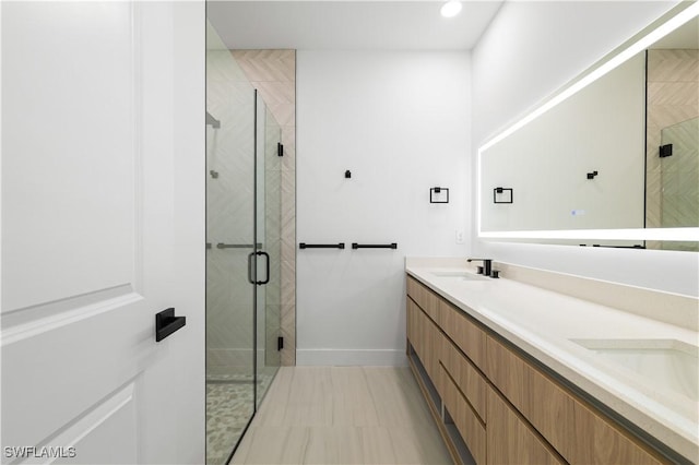 3201 18th St W, Lehigh Acres, FL 33971 - full bathroom with a shower stall, double vanity, baseboards, and recessed lighting