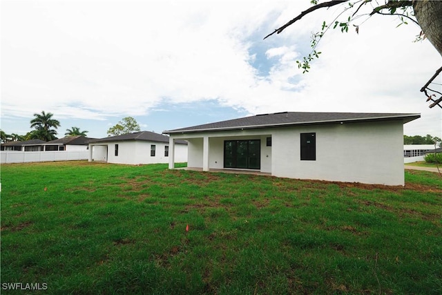 3201 18th St W, Lehigh Acres, FL 33971 - back of house featuring stucco siding