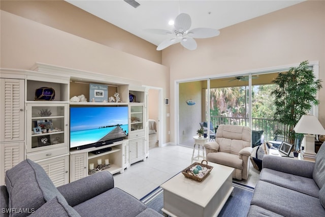 15040 Sandpiper Preserve Blvd Unit 201, Fort Myers, FL 33919 - living room with a ceiling fan, tile patterned floors, and a high ceiling