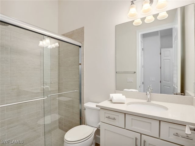 16289 Camden Lakes Cir, Naples, FL 34110 - full bath with a stall shower, vanity, and toilet