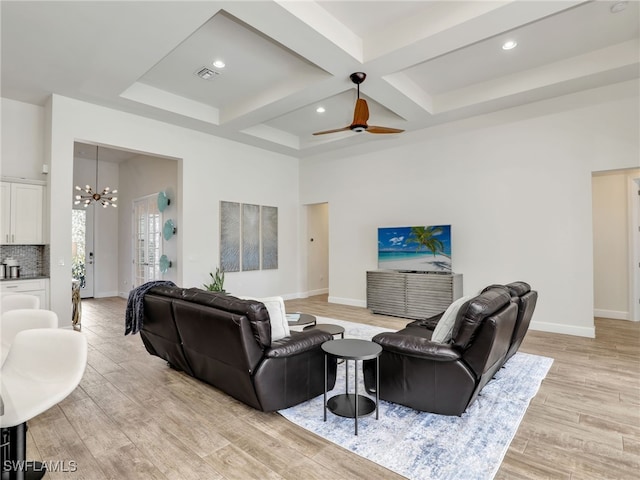 16289 Camden Lakes Cir, Naples, FL 34110 - living room with a chandelier, coffered ceiling, light wood finished floors, beamed ceiling, and baseboards