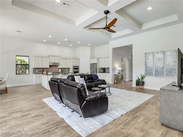 16289 Camden Lakes Cir, Naples, FL 34110 - living area with a high ceiling, coffered ceiling, recessed lighting, light wood-style flooring, and a ceiling fan