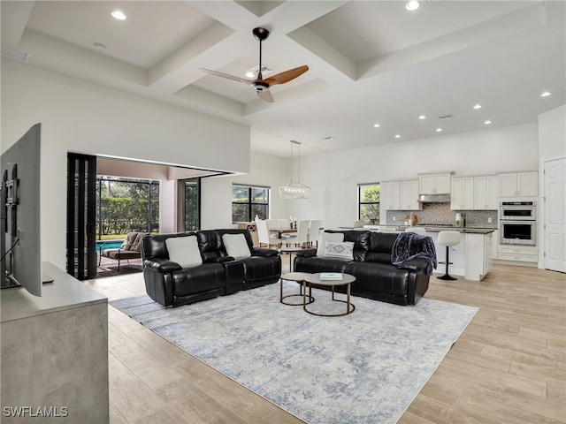16289 Camden Lakes Cir, Naples, FL 34110 - living area featuring a high ceiling, coffered ceiling, recessed lighting, light wood-style flooring, and a ceiling fan