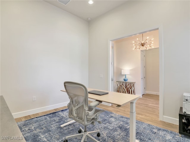 16289 Camden Lakes Cir, Naples, FL 34110 - office area with wood finished floors, baseboards, a chandelier, and recessed lighting