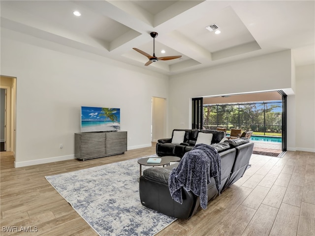16289 Camden Lakes Cir, Naples, FL 34110 - living room with a high ceiling, a ceiling fan, coffered ceiling, baseboards, and light wood-type flooring