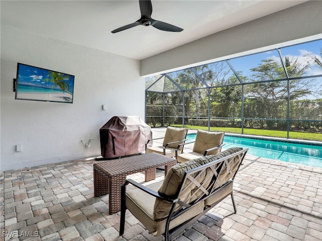 16289 Camden Lakes Cir, Naples, FL 34110 - view of patio featuring grilling area, an outdoor pool, a ceiling fan, and glass enclosure