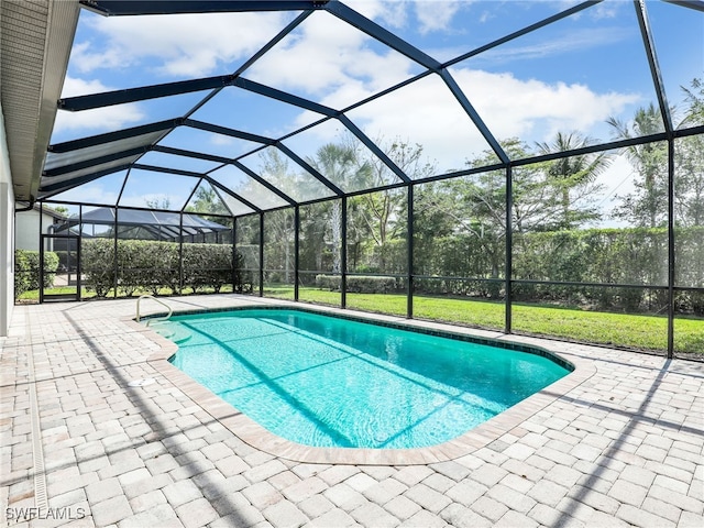 16289 Camden Lakes Cir, Naples, FL 34110 - outdoor pool featuring a patio and a lanai