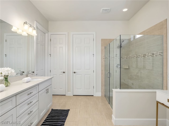 16289 Camden Lakes Cir, Naples, FL 34110 - bathroom featuring a shower stall, vanity, recessed lighting, and baseboards