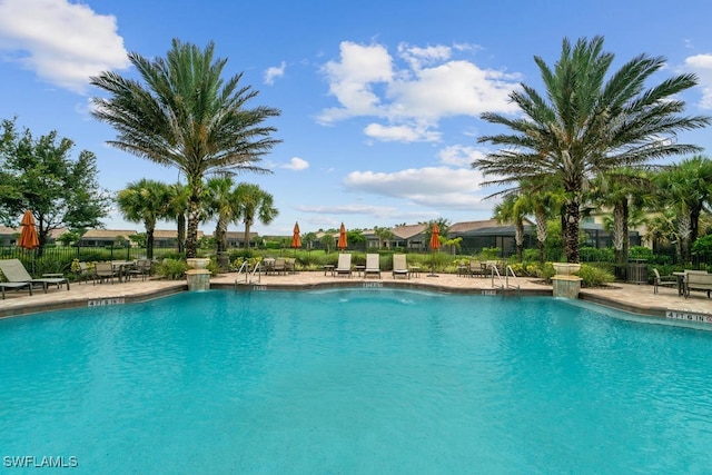16289 Camden Lakes Cir, Naples, FL 34110 - community pool featuring fence and a patio