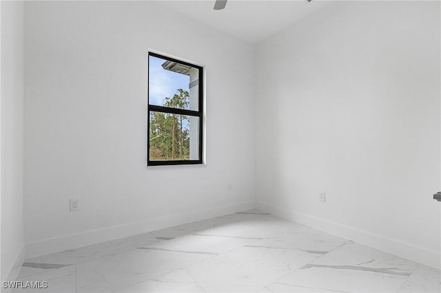 716 David Laird Ln, Lehigh Acres, FL 33974 - spare room with baseboards and marble look tile flooring