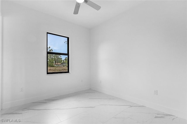 716 David Laird Ln, Lehigh Acres, FL 33974 - unfurnished room with baseboards, marble finish floors, and ceiling fan