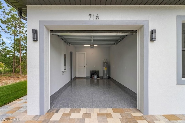 716 David Laird Ln, Lehigh Acres, FL 33974 - garage with water heater and electric panel