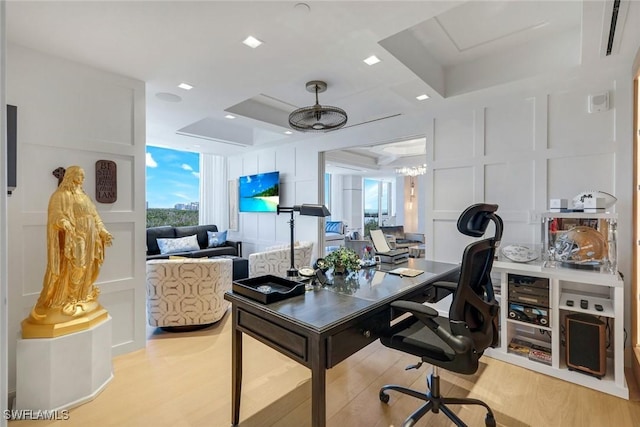 6897 Grenadier Blvd Unit 601, Naples, FL 34108 - office featuring wood finished floors and a decorative wall