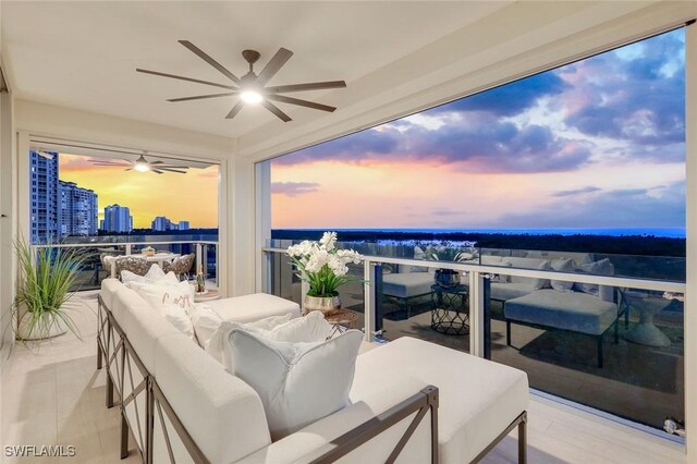 6897 Grenadier Blvd Unit 601, Naples, FL 34108 - balcony featuring a ceiling fan and an outdoor hangout area