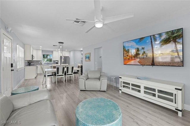 222 Mango St, Fort Myers Beach, FL 33931 - living area with light wood-style floors, baseboards, a ceiling fan, and recessed lighting