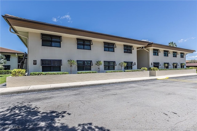525 Seaview Ct Unit M1, Marco Island, FL 34145 - view of property with uncovered parking