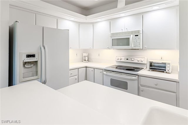 525 Seaview Ct Unit M1, Marco Island, FL 34145 - kitchen with white appliances, light countertops, white cabinets, and recessed lighting