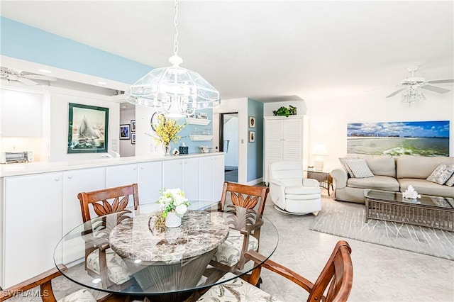 525 Seaview Ct Unit M1, Marco Island, FL 34145 - dining space with a ceiling fan and a chandelier