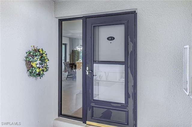 525 Seaview Ct Unit M1, Marco Island, FL 34145 - doorway to property with stucco siding