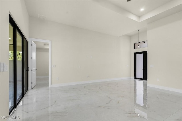 956 Columbus Blvd S, Lehigh Acres, FL 33974 - spare room with light marble finish flooring, baseboards, and recessed lighting