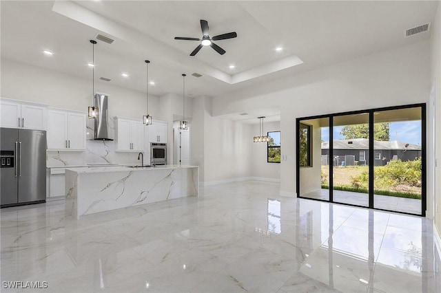 956 Columbus Blvd S, Lehigh Acres, FL 33974 - unfurnished living room with a high ceiling, light marble finish flooring, ceiling fan, a raised ceiling, and recessed lighting