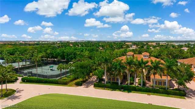 10692 Mirasol Dr Unit 1004, Miromar Lakes, FL 33913 - bird's eye view of a tree filled landscape