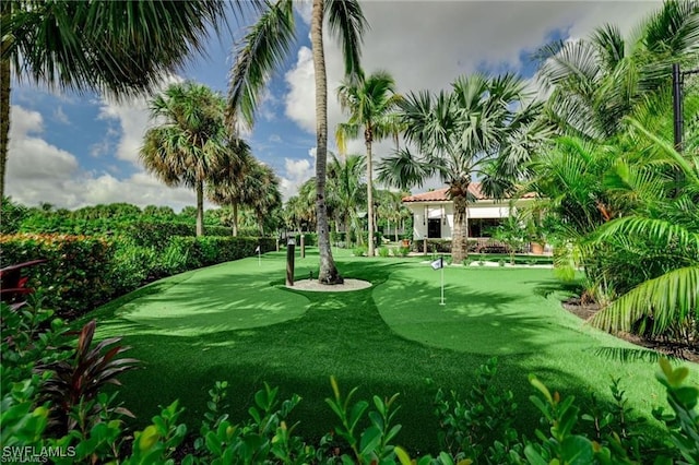 10692 Mirasol Dr Unit 1004, Miromar Lakes, FL 33913 - view of community featuring an area to practice putting