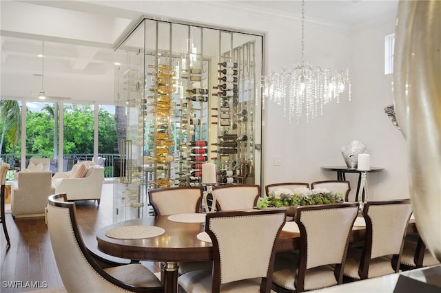 10692 Mirasol Dr Unit 1004, Miromar Lakes, FL 33913 - wine cellar with wood finished floors, ornamental molding, a chandelier, and beam ceiling
