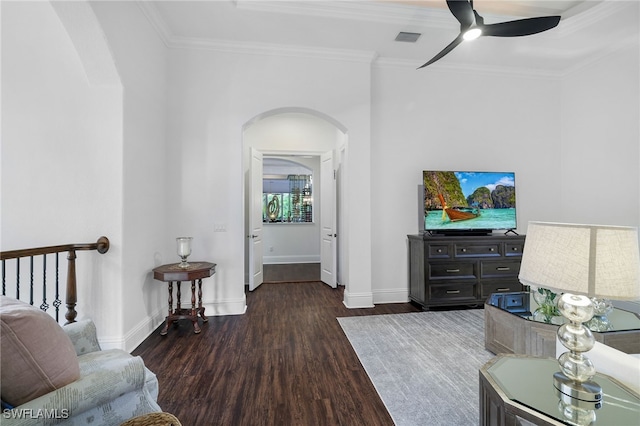 10692 Mirasol Dr Unit 1004, Miromar Lakes, FL 33913 - living area featuring arched walkways, wood finished floors, a ceiling fan, crown molding, and baseboards