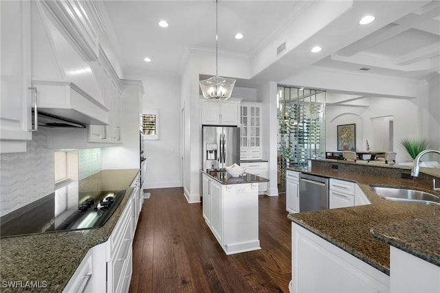 10692 Mirasol Dr Unit 1004, Miromar Lakes, FL 33913 - kitchen with a sink, appliances with stainless steel finishes, a kitchen island, tasteful backsplash, and custom range hood