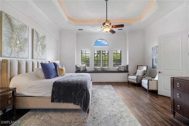 10692 Mirasol Dr Unit 1004, Miromar Lakes, FL 33913 - bedroom with a raised ceiling, dark wood-style flooring, ornamental molding, a ceiling fan, and baseboards