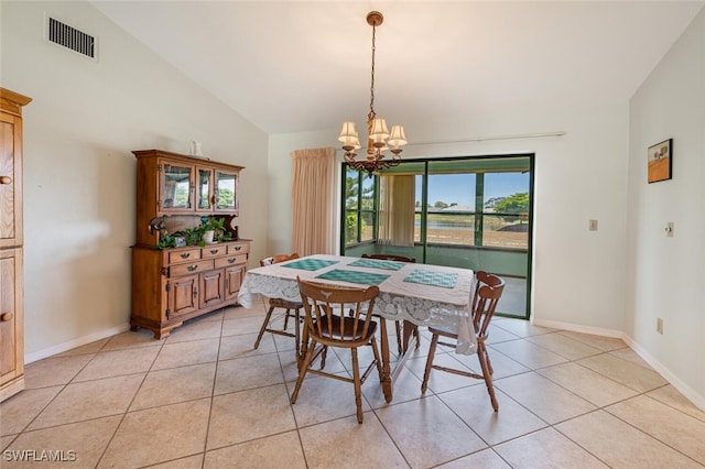 938 Charlemagne Blvd, Naples, FL 34112 - dining area featuring a chandelier, light tile patterned floors, vaulted ceiling, and baseboards