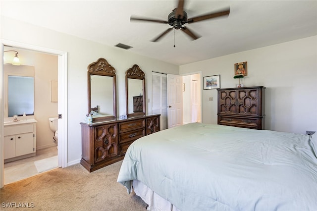 938 Charlemagne Blvd, Naples, FL 34112 - bedroom with light colored carpet, a sink, connected bathroom, baseboards, and a ceiling fan