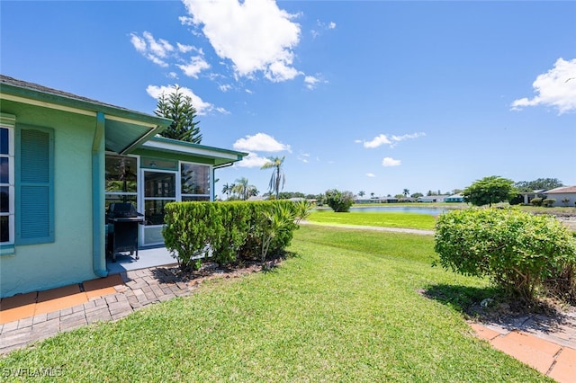 938 Charlemagne Blvd, Naples, FL 34112 - view of grassy yard with a water view and a sunroom