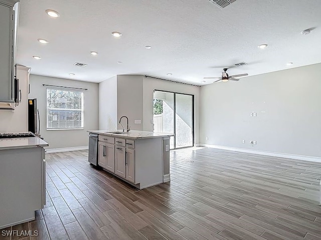 4564 Almada Ln, Wesley Chapel, FL 33543 - kitchen featuring healthy amount of natural light, a ceiling fan, wood finished floors, baseboards, and recessed lighting