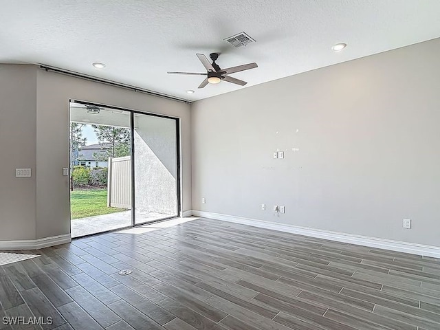 4564 Almada Ln, Wesley Chapel, FL 33543 - empty room with wood finished floors, baseboards, a ceiling fan, recessed lighting, and a textured ceiling